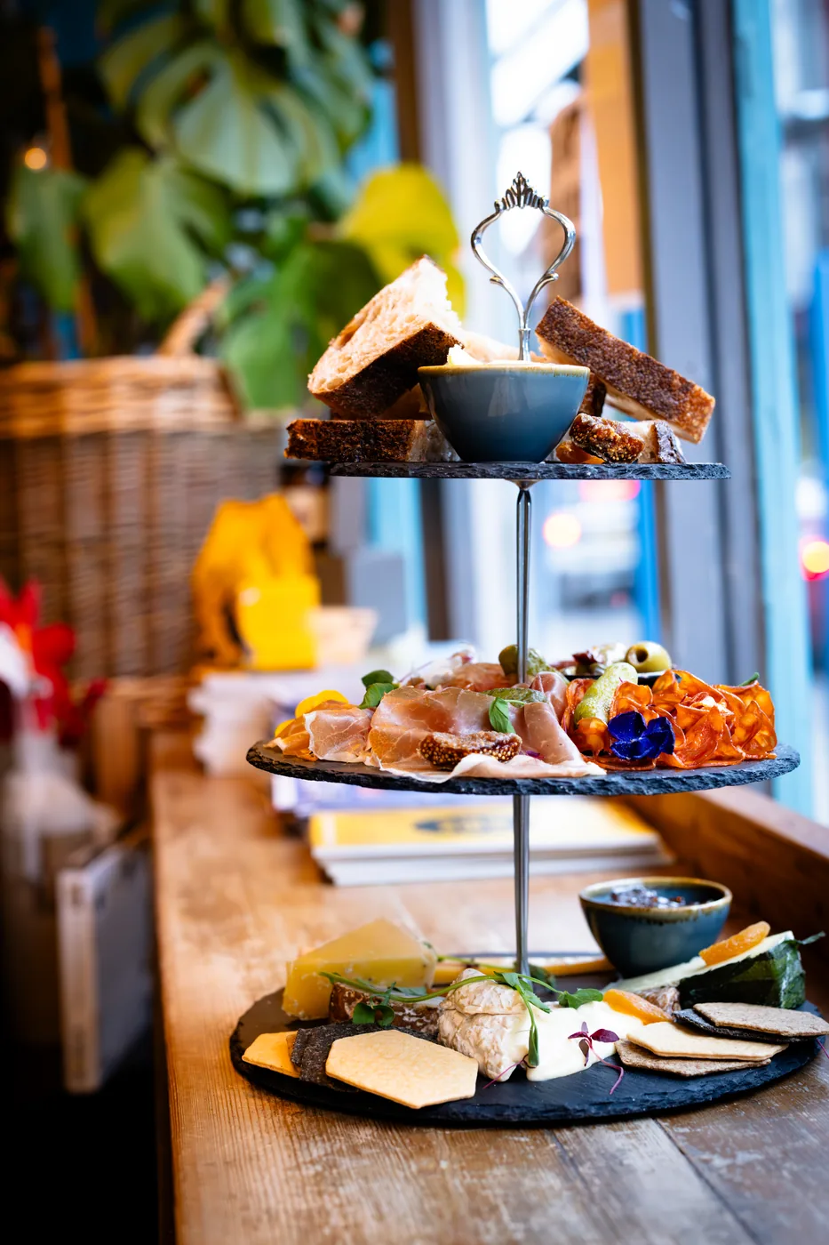 A tiered stand of bread, charcuterie and cheese at The Speakcheesey